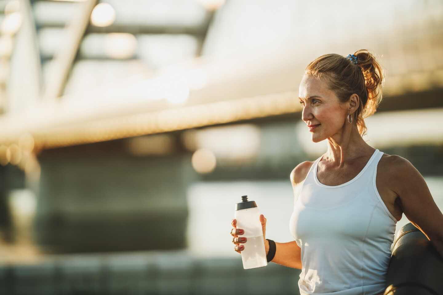 Fit women with water bottle